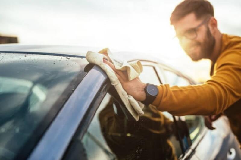 Man cleaning the car