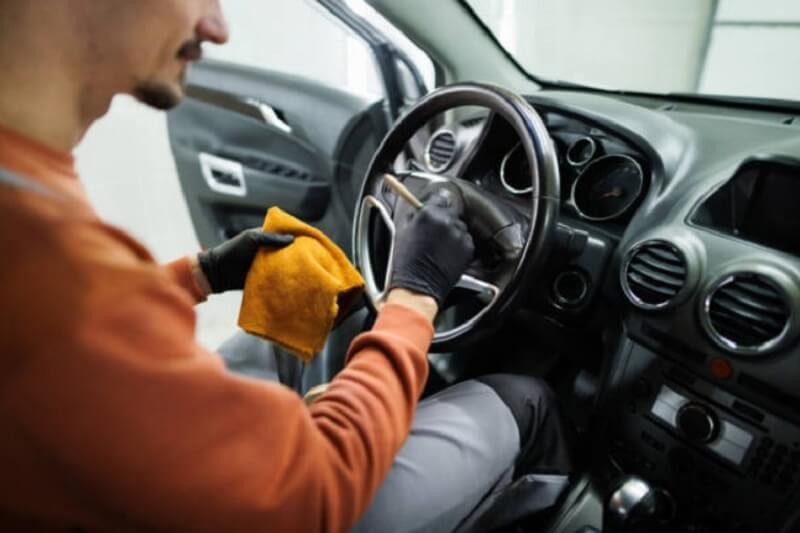 Man doing car detailing