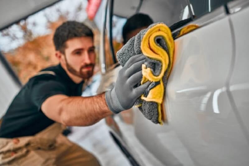 Man using Microfiber cloth for car